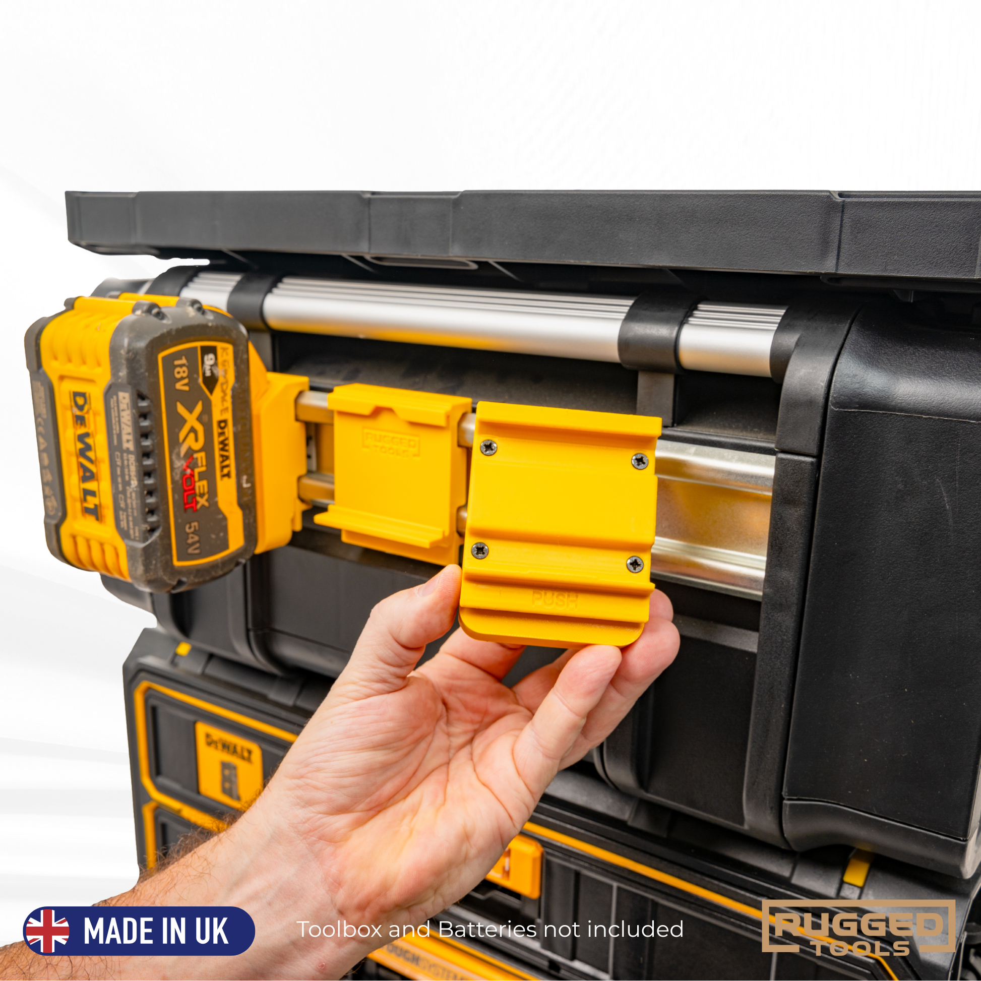 Yellow Rugged Tools R-Clip holding a DeWalt charger on a TOUGHSYSTEM 2.0 DXL drawer