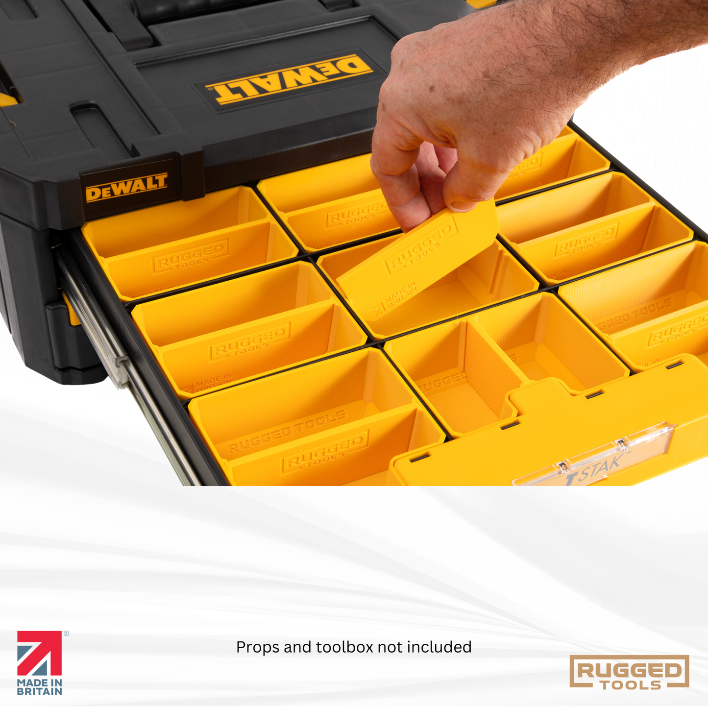 Tradesperson lifting a Rugged Tools bin out of a DeWalt TSTAK drawer